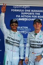 (L to R): Lewis Hamilton (GBR) Mercedes AMG F1 celebrates his pole position with second placed team mate Nico Rosberg (GER) Mercedes AMG F1 in parc ferme. 11.10.2014. Formula 1 World Championship, Rd 16, Russian Grand Prix, Sochi Autodrom, Sochi, Russia, Qualifying Day.