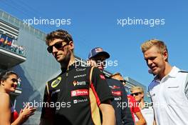 (L to R): Romain Grosjean (FRA) Lotus F1 Team with Kevin Magnussen (DEN) McLaren on the drivers parade. 12.10.2014. Formula 1 World Championship, Rd 16, Russian Grand Prix, Sochi Autodrom, Sochi, Russia, Race Day.