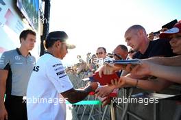 Lewis Hamilton (GBR) Mercedes AMG F1 signs autographs for the fans at the Fanzone. 09.10.2014. Formula 1 World Championship, Rd 16, Russian Grand Prix, Sochi Autodrom, Sochi, Russia, Preparation Day.