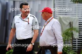 (L to R): Eric Boullier (FRA) McLaren Racing Director with Niki Lauda (AUT) Mercedes Non-Executive Chairman. 19.09.2014. Formula 1 World Championship, Rd 14, Singapore Grand Prix, Singapore, Singapore, Practice Day.