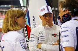 (L to R): Susie Wolff (GBR) Williams Development Driver with Valtteri Bottas (FIN) Williams. 19.09.2014. Formula 1 World Championship, Rd 14, Singapore Grand Prix, Singapore, Singapore, Practice Day.