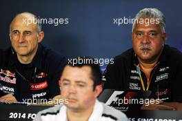 (L to R): Franz Tost (AUT) Scuderia Toro Rosso Team Principal with Eric Boullier (FRA) McLaren Racing Director and Dr. Vijay Mallya (IND) Sahara Force India F1 Team Owner in the FIA Press Conference. 19.09.2014. Formula 1 World Championship, Rd 14, Singapore Grand Prix, Singapore, Singapore, Practice Day.