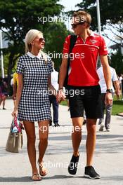 Max Chilton (GBR) Marussia F1 Team with his girlfriend Chloe Roberts (GBR). 19.09.2014. Formula 1 World Championship, Rd 14, Singapore Grand Prix, Singapore, Singapore, Practice Day.