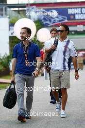 Felipe Massa (BRA) Williams (Right) with Nicolas Todt (FRA) Driver Manager. 19.09.2014. Formula 1 World Championship, Rd 14, Singapore Grand Prix, Singapore, Singapore, Practice Day.