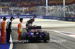 Sebastian Vettel (GER) Red Bull Racing RB10 stops at the end of FP1. 19.09.2014. Formula 1 World Championship, Rd 14, Singapore Grand Prix, Singapore, Singapore, Practice Day.