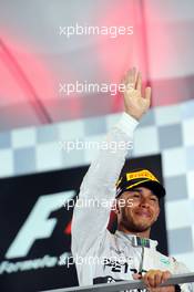 Race winner Lewis Hamilton (GBR) Mercedes AMG F1 celebrates on the podium. 21.09.2014. Formula 1 World Championship, Rd 14, Singapore Grand Prix, Singapore, Singapore, Race Day.