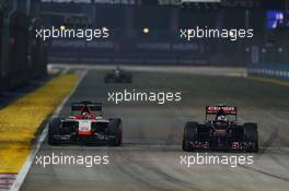 Jules Bianchi (FRA) Marussia F1 Team MR03 and Daniil Kvyat (RUS) Scuderia Toro Rosso STR9. 21.09.2014. Formula 1 World Championship, Rd 14, Singapore Grand Prix, Singapore, Singapore, Race Day.