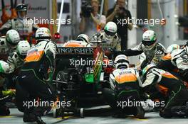 Nico Hulkenberg (GER) Sahara Force India F1 VJM07 makes a pit stop. 21.09.2014. Formula 1 World Championship, Rd 14, Singapore Grand Prix, Singapore, Singapore, Race Day.