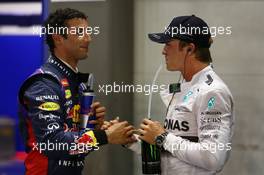 Daniel Ricciardo (AUS) Red Bull Racing RB10 and Nico Rosberg (GER) Mercedes AMG F1 W05. 20.09.2014. Formula 1 World Championship, Rd 14, Singapore Grand Prix, Singapore, Singapore, Qualifying Day.