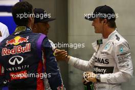Daniel Ricciardo (AUS) Red Bull Racing RB10 with Nico Rosberg (GER) Mercedes AMG F1 W05 and Lewis Hamilton (GBR) Mercedes AMG F1 W05. 20.09.2014. Formula 1 World Championship, Rd 14, Singapore Grand Prix, Singapore, Singapore, Qualifying Day.