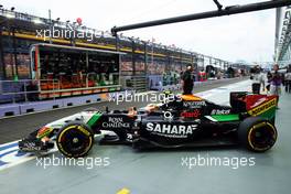 Sergio Perez (MEX) Sahara Force India F1 VJM07 leaves the pits. 20.09.2014. Formula 1 World Championship, Rd 14, Singapore Grand Prix, Singapore, Singapore, Qualifying Day.