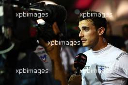 Jules Bianchi (FRA) Marussia F1 Team with the media. 20.09.2014. Formula 1 World Championship, Rd 14, Singapore Grand Prix, Singapore, Singapore, Qualifying Day.