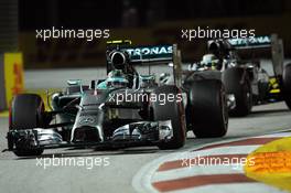 Nico Rosberg (GER) Mercedes AMG F1 W05 leads team mate Lewis Hamilton (GBR) Mercedes AMG F1 W05. 20.09.2014. Formula 1 World Championship, Rd 14, Singapore Grand Prix, Singapore, Singapore, Qualifying Day.