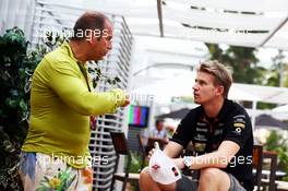 (L to R): Kai Ebel (GER) RTL TV Presenter with Nico Hulkenberg (GER) Sahara Force India F1. 18.09.2014. Formula 1 World Championship, Rd 14, Singapore Grand Prix, Singapore, Singapore, Preparation Day.