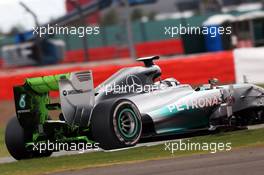 Nico Rosberg (GER) Mercedes AMG F1 W05 running flow-vis paint on the rear wing. 08.07.2014. Formula One Testing, Silverstone, England, Tuesday.