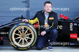 Paul Hembery (GBR) Pirelli Motorsport Director and the Lotus F1 E22 with new 18 inch Pirelli tyres and rims. 09.07.2014. Formula One Testing, Silverstone, England, Wednesday.