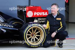 Mario Isola (ITA) Pirelli Racing Manager and the Lotus F1 E22 with new 18 inch Pirelli tyres and rims. 09.07.2014. Formula One Testing, Silverstone, England, Wednesday.