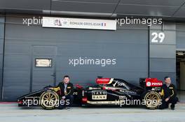 (L to R): Paul Hembery (GBR) Pirelli Motorsport Director and Mario Isola (ITA) Pirelli Racing Manager and the Lotus F1 E22 with new 18 inch Pirelli tyres and rims. 09.07.2014. Formula One Testing, Silverstone, England, Wednesday.