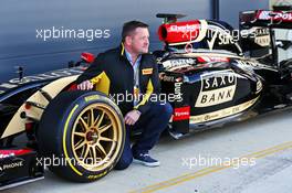 Paul Hembery (GBR) Pirelli Motorsport Director with the Lotus F1 E22 with new 18 inch Pirelli tyres and rims. 09.07.2014. Formula One Testing, Silverstone, England, Wednesday.