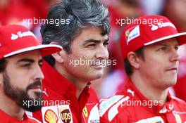 (L to R): Fernando Alonso (ESP) Ferrari with Marco Mattiacci (ITA) Ferrari Team Principal and Kimi Raikkonen (FIN) Ferrari at a team photograph. 21.11.2014. Formula 1 World Championship, Rd 19, Abu Dhabi Grand Prix, Yas Marina Circuit, Abu Dhabi, Practice Day.
