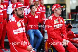 (L to R): Fernando Alonso (ESP) Ferrari and team mate Kimi Raikkonen (FIN) Ferrari at a team photograph. 21.11.2014. Formula 1 World Championship, Rd 19, Abu Dhabi Grand Prix, Yas Marina Circuit, Abu Dhabi, Practice Day.