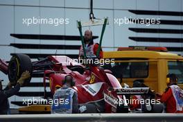 The Ferrari F14-T of Fernando Alonso (ESP) Ferrari is recovered back to the pits on the back of a truck. 21.11.2014. Formula 1 World Championship, Rd 19, Abu Dhabi Grand Prix, Yas Marina Circuit, Abu Dhabi, Practice Day.