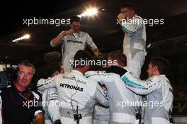 Mercedes AMG F1 team celebrate victory and the World Championship for Lewis Hamilton (GBR) Mercedes AMG F1. 23.11.2014. Formula 1 World Championship, Rd 19, Abu Dhabi Grand Prix, Yas Marina Circuit, Abu Dhabi, Race Day.