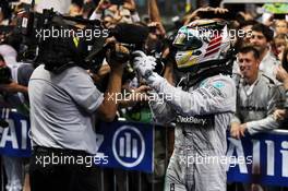 Race winner and World Champion Lewis Hamilton (GBR) Mercedes AMG F1 celebrates in parc ferme. 23.11.2014. Formula 1 World Championship, Rd 19, Abu Dhabi Grand Prix, Yas Marina Circuit, Abu Dhabi, Race Day.