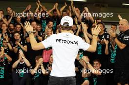 Nico Rosberg (GER) Mercedes AMG F1 celebrates with the Mercedes AMG F1 team. 23.11.2014. Formula 1 World Championship, Rd 19, Abu Dhabi Grand Prix, Yas Marina Circuit, Abu Dhabi, Race Day.