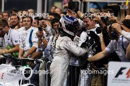 Valtteri Bottas (FIN) Williams celebrates his third position with the team in parc ferme. 23.11.2014. Formula 1 World Championship, Rd 19, Abu Dhabi Grand Prix, Yas Marina Circuit, Abu Dhabi, Race Day.