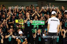 Nico Rosberg (GER) Mercedes AMG F1 celebrates with the Mercedes AMG F1 team. 23.11.2014. Formula 1 World Championship, Rd 19, Abu Dhabi Grand Prix, Yas Marina Circuit, Abu Dhabi, Race Day.