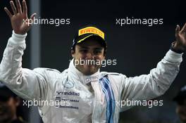 Felipe Massa (BRA) Williams celebrates his second position on the podium. 23.11.2014. Formula 1 World Championship, Rd 19, Abu Dhabi Grand Prix, Yas Marina Circuit, Abu Dhabi, Race Day.