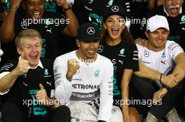 1st place and World Champion Lewis Hamilton (GBR) Mercedes AMG F1 W05 with Nicole Scherzinger (USA) Singer, girlfriend of Lewis Hamilton and Nico Rosberg (GER) Mercedes AMG F1 W05. 23.11.2014. Formula 1 World Championship, Rd 19, Abu Dhabi Grand Prix, Yas Marina Circuit, Abu Dhabi, Race Day.