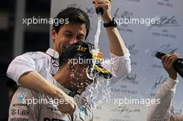 Race winner and World Championship Lewis Hamilton (GBR) Mercedes AMG F1 celebrates on the podium with Toto Wolff (GER) Mercedes AMG F1 Shareholder and Executive Director. 23.11.2014. Formula 1 World Championship, Rd 19, Abu Dhabi Grand Prix, Yas Marina Circuit, Abu Dhabi, Race Day.