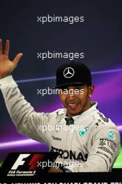 Race winner and World Champion Lewis Hamilton (GBR) Mercedes AMG F1 in the FIA Press Conference. 23.11.2014. Formula 1 World Championship, Rd 19, Abu Dhabi Grand Prix, Yas Marina Circuit, Abu Dhabi, Race Day.
