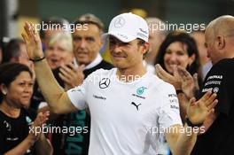 Nico Rosberg (GER) Mercedes AMG F1 celebrates with the team. 23.11.2014. Formula 1 World Championship, Rd 19, Abu Dhabi Grand Prix, Yas Marina Circuit, Abu Dhabi, Race Day.