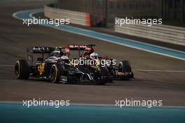 Kevin Magnussen (DEN) McLaren MP4-29 and Romain Grosjean (FRA) Lotus F1 E22 battle for position. 23.11.2014. Formula 1 World Championship, Rd 19, Abu Dhabi Grand Prix, Yas Marina Circuit, Abu Dhabi, Race Day.