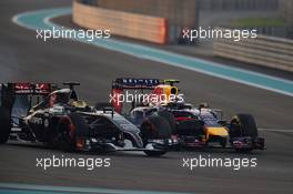 Adrian Sutil (GER) Sauber C33 and Daniel Ricciardo (AUS) Red Bull Racing RB10 battle for position. 23.11.2014. Formula 1 World Championship, Rd 19, Abu Dhabi Grand Prix, Yas Marina Circuit, Abu Dhabi, Race Day.