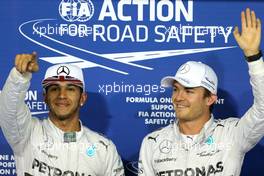 Lewis Hamilton (GBR), Mercedes AMG F1 Team and Nico Rosberg (GER), Mercedes AMG F1 Team  22.11.2014. Formula 1 World Championship, Rd 19, Abu Dhabi Grand Prix, Yas Marina Circuit, Abu Dhabi, Qualifying Day.