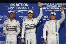 Pole for Nico Rosberg (GER) Mercedes AMG F1 W05, 2nd for Lewis Hamilton (GBR) Mercedes AMG F1 and 3rd for Valtteri Bottas (FIN) Williams FW36. 22.11.2014. Formula 1 World Championship, Rd 19, Abu Dhabi Grand Prix, Yas Marina Circuit, Abu Dhabi, Qualifying Day.