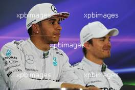 (L to R): Lewis Hamilton (GBR) Mercedes AMG F1 and team mate Nico Rosberg (GER) Mercedes AMG F1 in the FIA Press Conference. 22.11.2014. Formula 1 World Championship, Rd 19, Abu Dhabi Grand Prix, Yas Marina Circuit, Abu Dhabi, Qualifying Day.