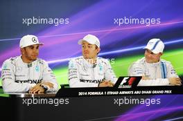 The post qualifying FIA Press Conference (L to R): Lewis Hamilton (GBR) Mercedes AMG F1, second; Nico Rosberg (GER) Mercedes AMG F1, pole position; Valtteri Bottas (FIN) Williams, third. 22.11.2014. Formula 1 World Championship, Rd 19, Abu Dhabi Grand Prix, Yas Marina Circuit, Abu Dhabi, Qualifying Day.