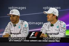 (L to R): Lewis Hamilton (GBR) Mercedes AMG F1 and team mate Nico Rosberg (GER) Mercedes AMG F1 in the FIA Press Conference. 22.11.2014. Formula 1 World Championship, Rd 19, Abu Dhabi Grand Prix, Yas Marina Circuit, Abu Dhabi, Qualifying Day.