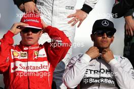 Kimi Raikkonen (FIN), Scuderia Ferrari and Lewis Hamilton (GBR), Mercedes AMG F1 Team  23.11.2014. Formula 1 World Championship, Rd 19, Abu Dhabi Grand Prix, Yas Marina Circuit, Abu Dhabi, Race Day.