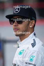 Lewis Hamilton (GBR) Mercedes AMG F1 at a team photograph. 23.11.2014. Formula 1 World Championship, Rd 19, Abu Dhabi Grand Prix, Yas Marina Circuit, Abu Dhabi, Race Day.