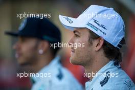 Nico Rosberg (GER) Mercedes AMG F1 with team mate Lewis Hamilton (GBR) Mercedes AMG F1 at a team photograph. 23.11.2014. Formula 1 World Championship, Rd 19, Abu Dhabi Grand Prix, Yas Marina Circuit, Abu Dhabi, Race Day.