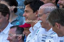 Toto Wolff (GER) Mercedes AMG F1 Shareholder and Executive Director and Dr. Dieter Zetsche (GER) Daimler AG CEO at a team photograph. 23.11.2014. Formula 1 World Championship, Rd 19, Abu Dhabi Grand Prix, Yas Marina Circuit, Abu Dhabi, Race Day.