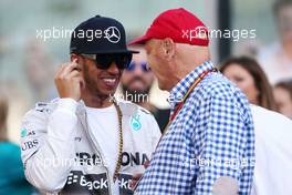 Lewis Hamilton (GBR), Mercedes AMG F1 Team and Niki Lauda (AUT) 23.11.2014. Formula 1 World Championship, Rd 19, Abu Dhabi Grand Prix, Yas Marina Circuit, Abu Dhabi, Race Day.