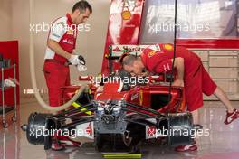 A Ferrari F14-T is prepared in the pits. 20.11.2014. Formula 1 World Championship, Rd 19, Abu Dhabi Grand Prix, Yas Marina Circuit, Abu Dhabi, Preparation Day.