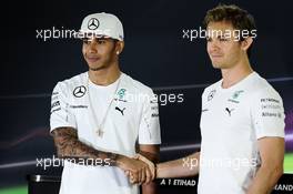 (L to R): Lewis Hamilton (GBR) Mercedes AMG F1 with team mate and fellow championship contender Nico Rosberg (GER) Mercedes AMG F1 in the FIA Press Conference. 20.11.2014. Formula 1 World Championship, Rd 19, Abu Dhabi Grand Prix, Yas Marina Circuit, Abu Dhabi, Preparation Day.
